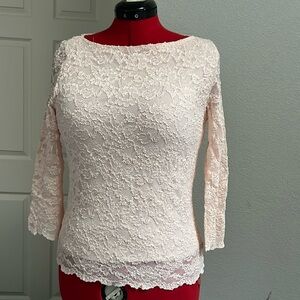 Good conditioning,  no snags.  Lace blouse.  Light pink